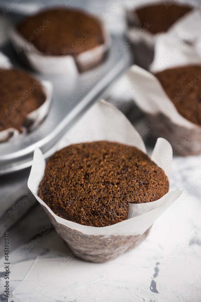 Chocolate muffins on the rustic background. Selective focus. Chocolate muffins on the rustic background. Selective focus.