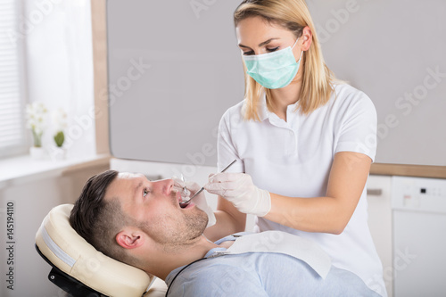 Oral Dental Checkup With Mirror
