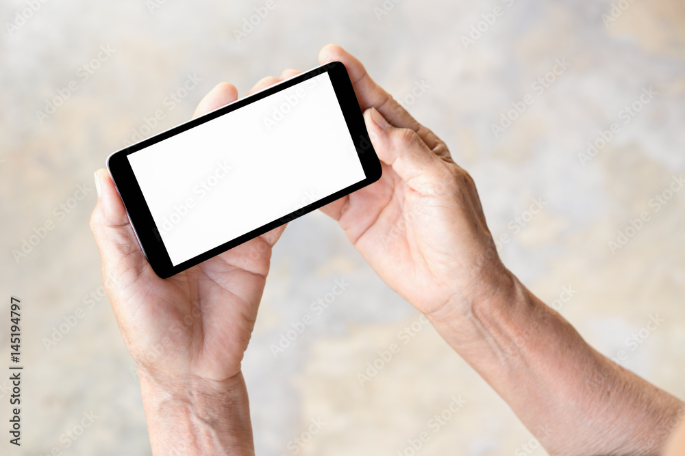 older person, hand holding smart phone with blank white screen