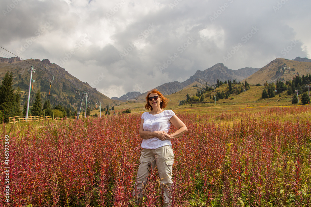 Woman at Shymbulak ski resort in summer, Almaty, Kazakhstan
