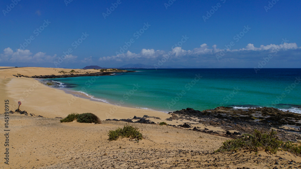 White sand beach with turquoise water of Corralejo on the island of Fuerteventura