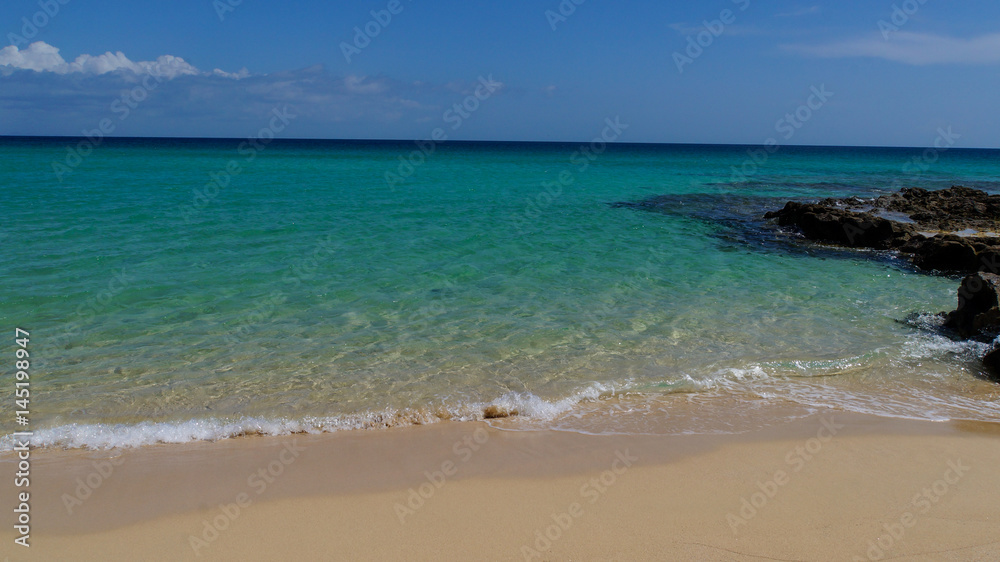 Turquoise water like paradise of Corralejo on the island of Fuerteventura Turquoise water like paradise of Corralejo on the island of Fuerteventura