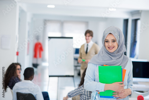 Arabic business woman working in team with her colleagues at startup office