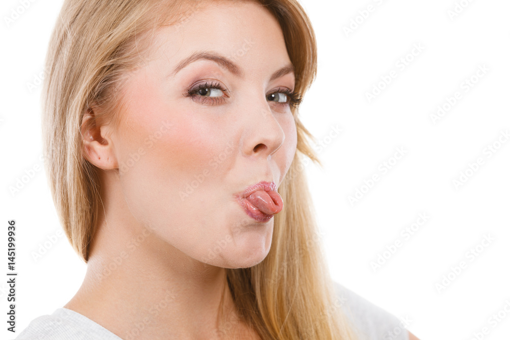 Funny blonde woman sitcking tongue out Funny blonde woman sitcking tongue out