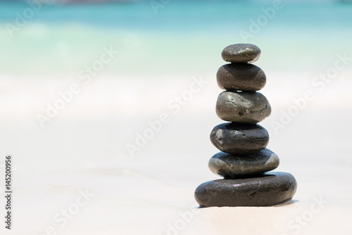 Zen Balancing Pebbles on Beach