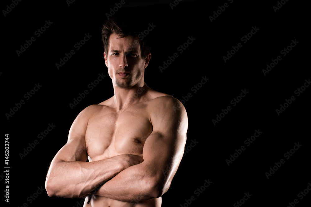 Sexy Shirtless Muscular Male Model on Black Background