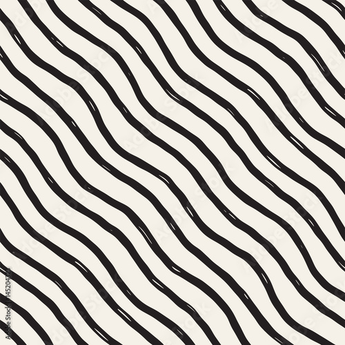 Decorative seamless pattern with handdrawn doodle lines. Hand painted wavy stripes background. Trendy endless freehand texture