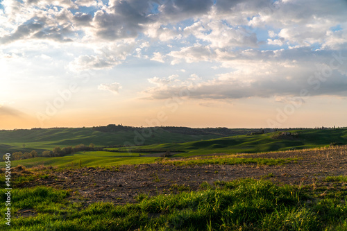 Sunset rays over Tuscany hills