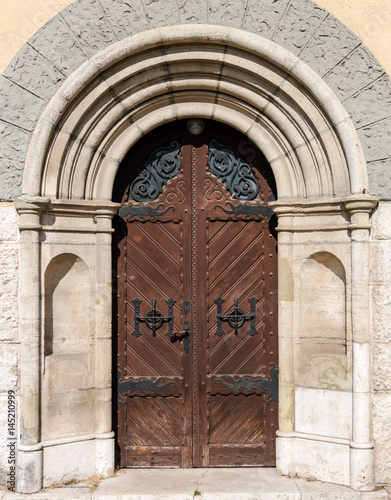 Old style front wooden door with metal decoration elements in Budapest