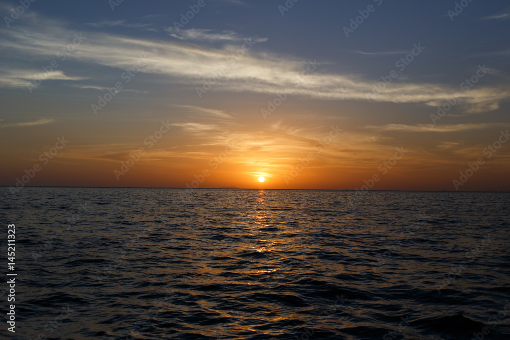 Picturesque sunset by sea shore