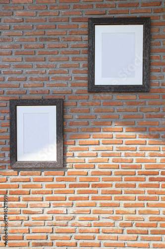  black frames on brick wall