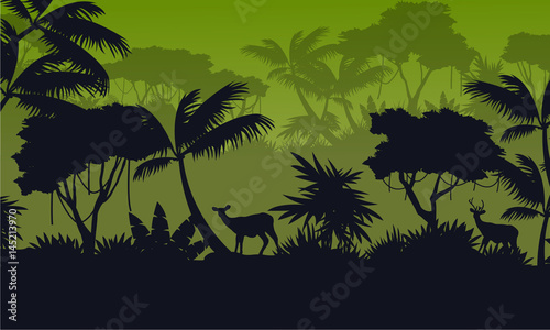 Forest scenery with deer silhouettes