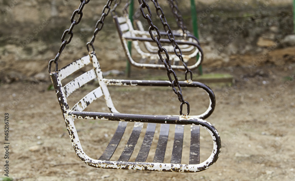 Rusted metal swings