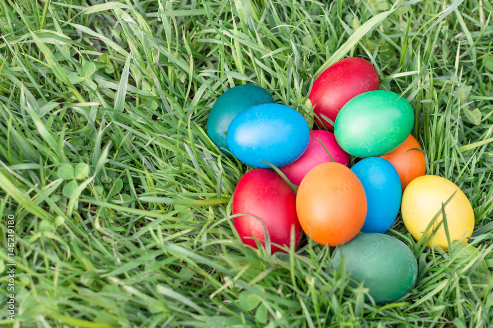 colored Easter eggs on the grass