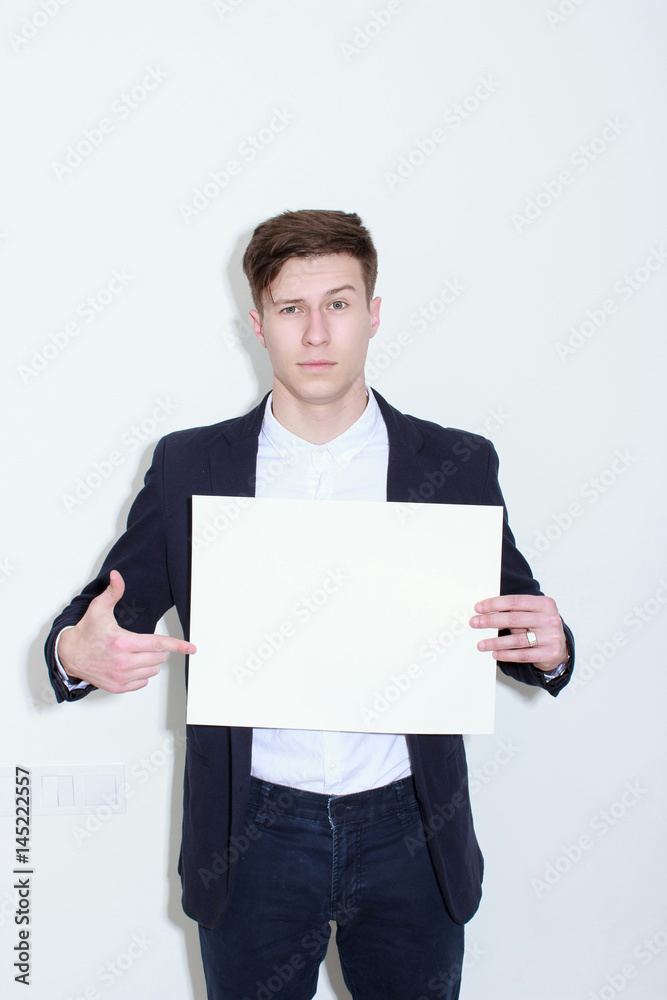 Happy smiling business man showing blank signboard Happy smiling business man showing blank signboard