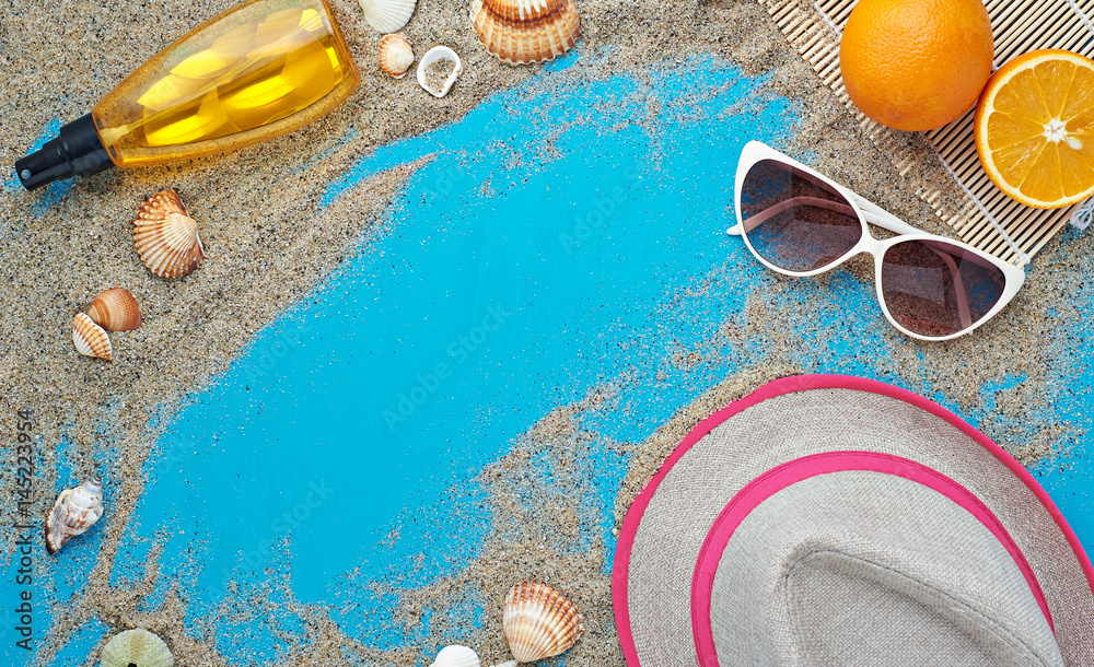 Naklejka premium Summer background. Beach vacation accessories flat lay on sand with seashells and azure colour texture. Resort mood and relax holiday.