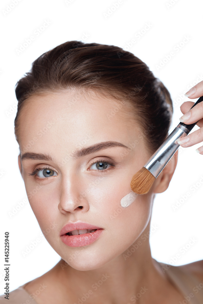 Woman Beauty Face Makeup. Female Applying Foundation