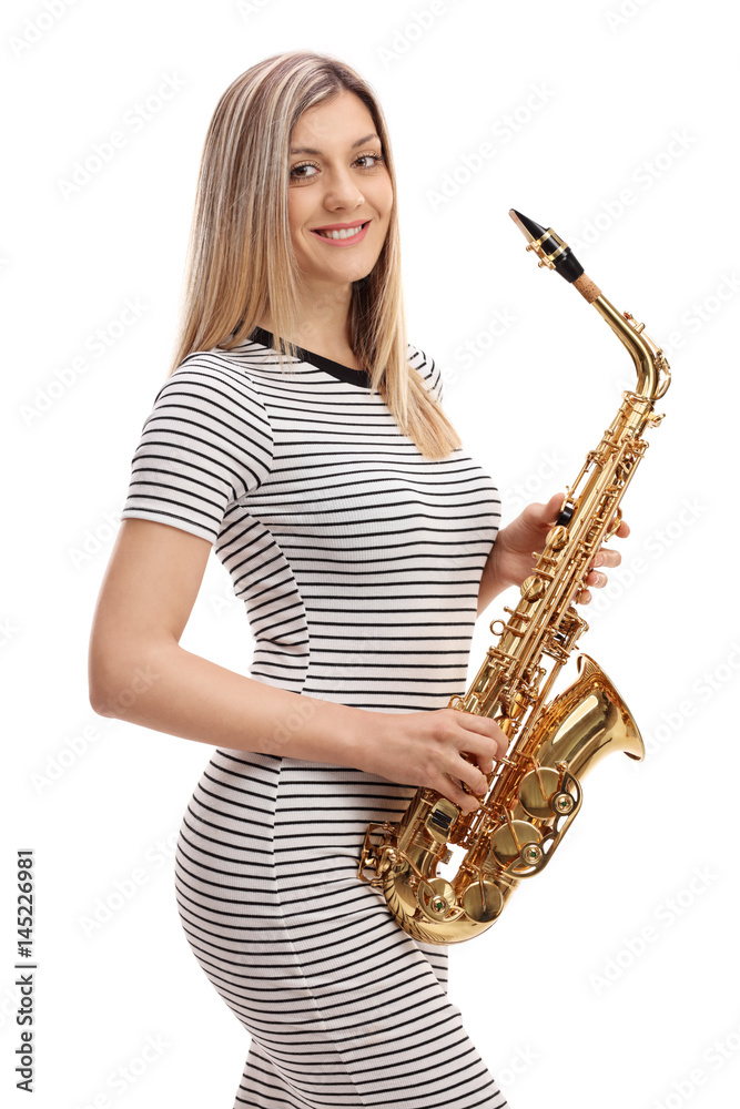 Obraz premium Young woman in a dress with a saxophone