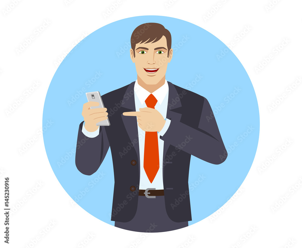 Businessman pointing at a mobile phone Businessman pointing at a mobile phone