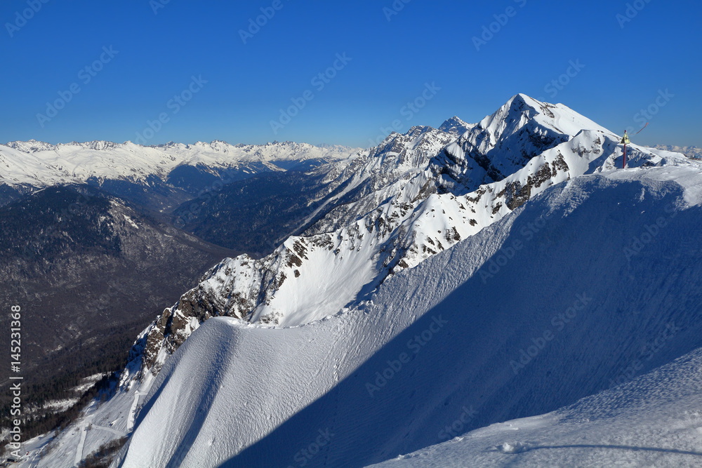 Snow-covered mountains in the ski resort Rosa Khutor, Russia