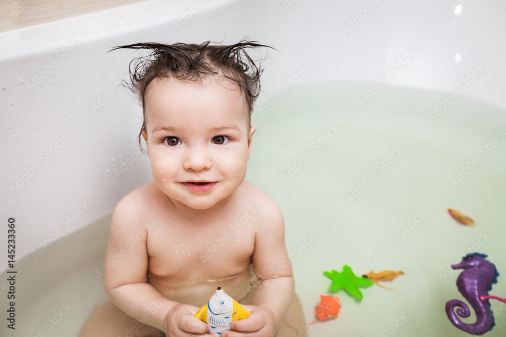 little boy with strange hairstyle taking bath little boy with strange hairstyle taking bath