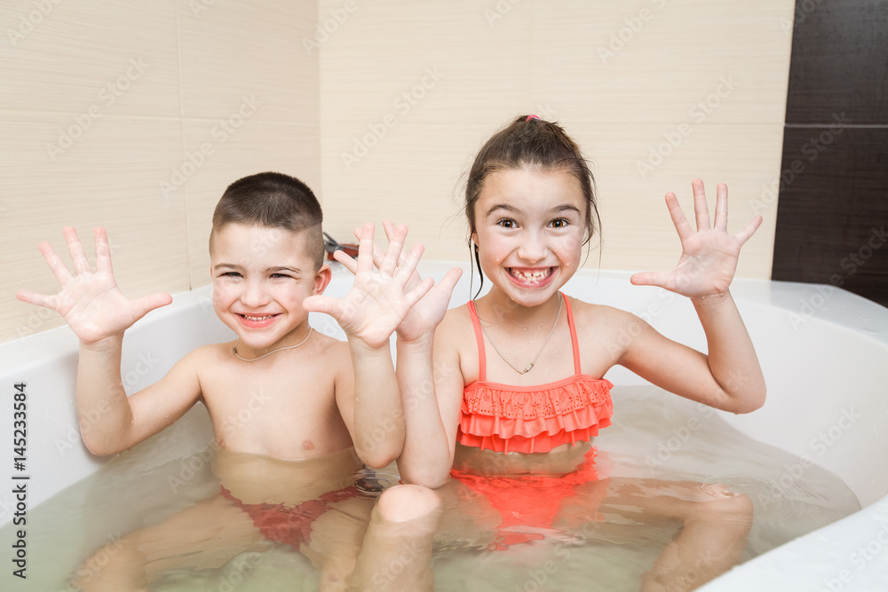bathing little sister Cute happy little brother and sister taking bath Stock 写真 | Adobe Stock