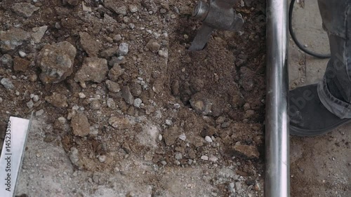 Wallpaper Mural Worker destroys concrete with a pneumatic impact hammer. 60fps. Close-up. 
 Torontodigital.ca