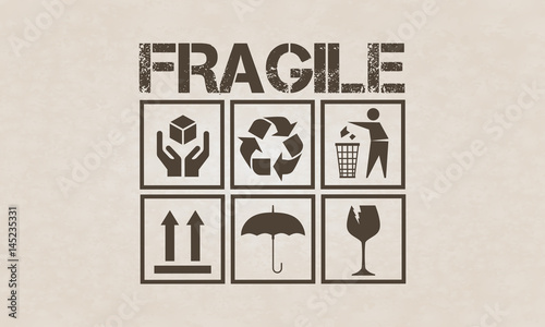 Fragile symbol set on brown cardboard photo