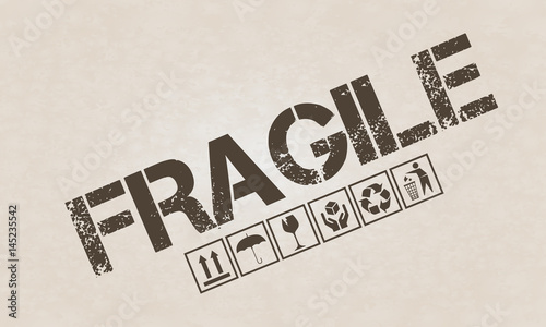 Fragile symbol set on brown cardboard photo