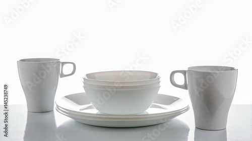 White crockery on a white background with reflections