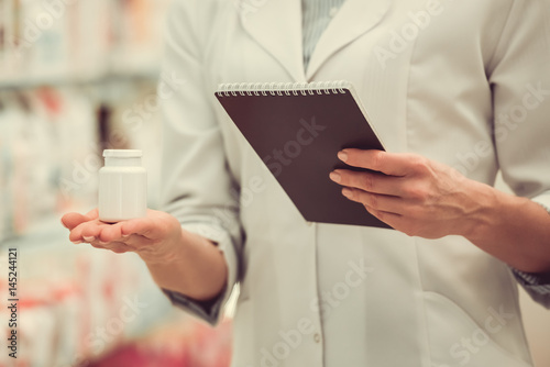 Beautiful pharmacist at work