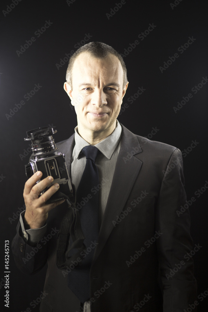 Photographer in studio in suit Photographer in studio in suit