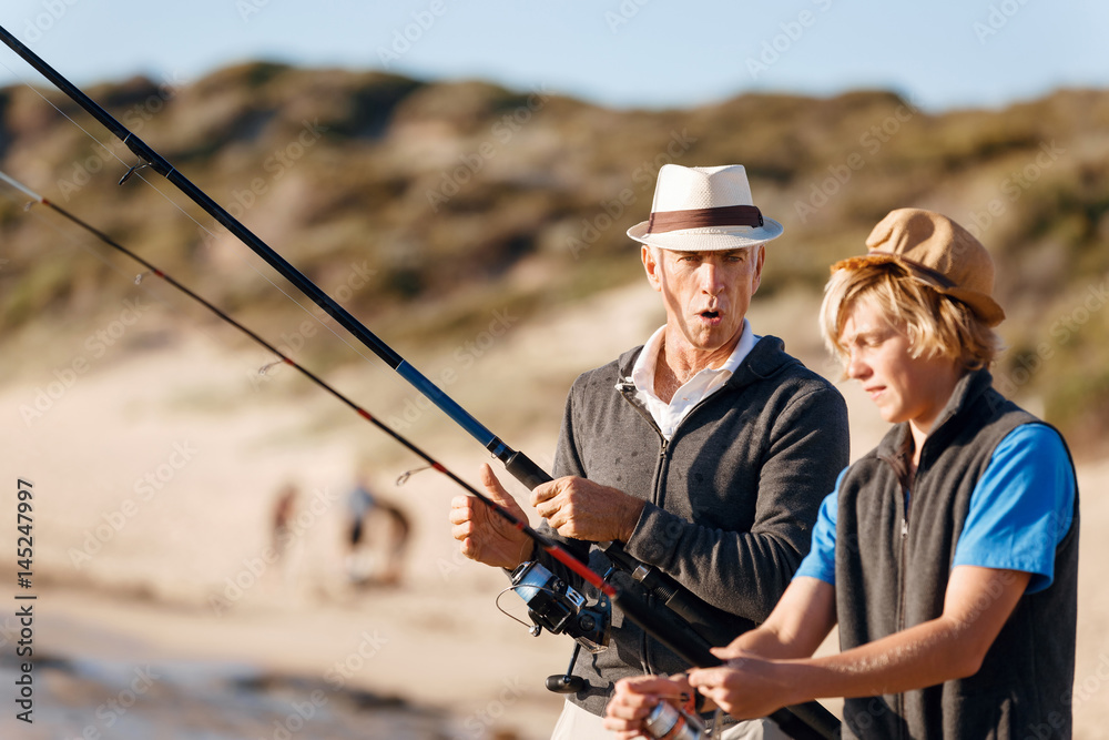 Senior man fishing with his grandson Senior man fishing with his grandson