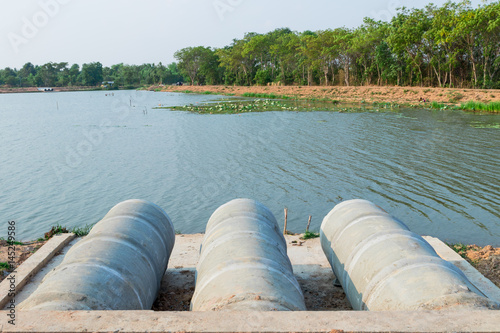 Three large row of cement pipes on riverside for drainage in the monsoon season.