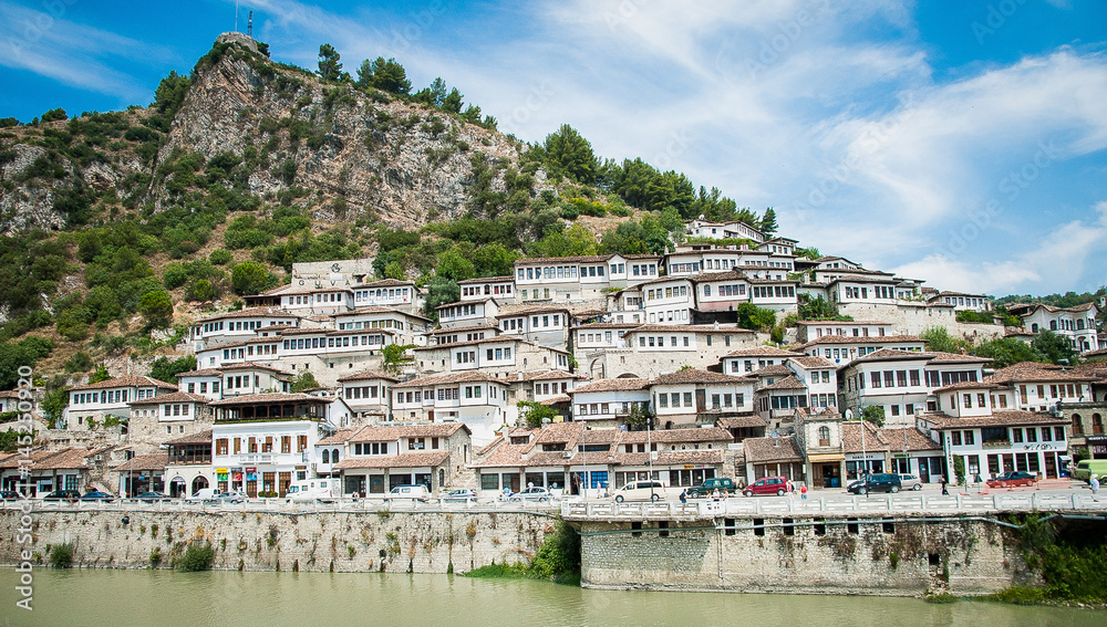 2016 Albania Berat - City of thousand windows, beautifull view of town on the hill between a lot of trees and blue sky