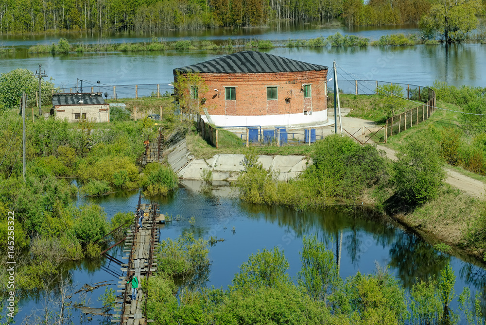 Obraz premium Tyumen, Russia - May 16, 2016: Metelevsky water intake station on Tura river. Water undergoes cleaning and comes to a city water supply system