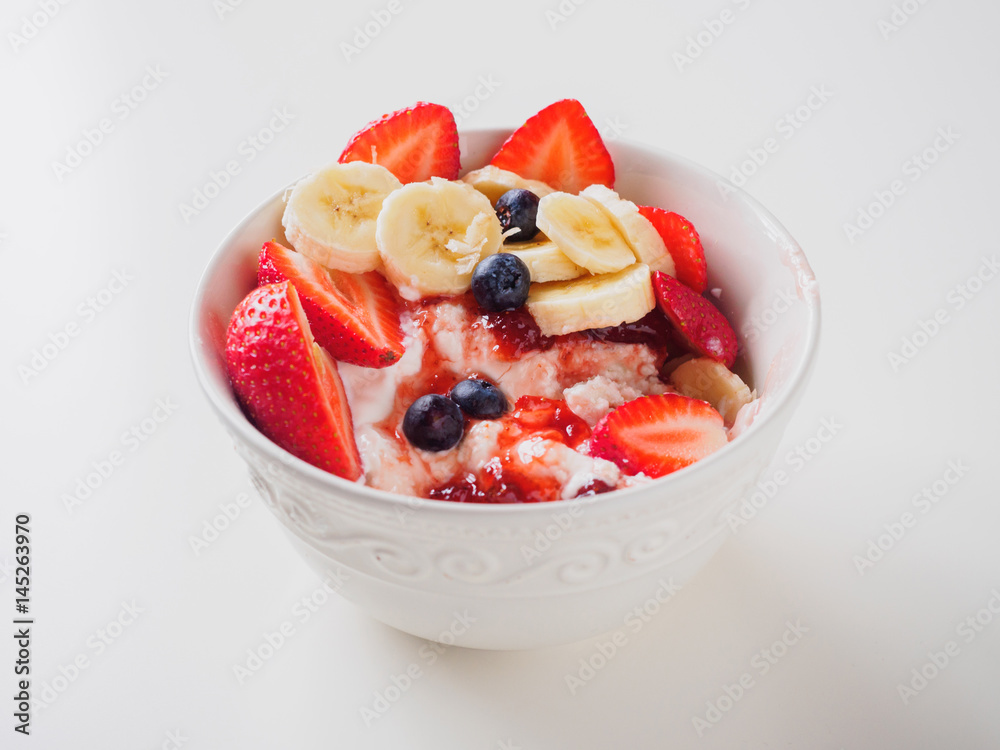 Bowl of curd with strawberry, blueberry and banana Bowl of curd with strawberry, blueberry and banana