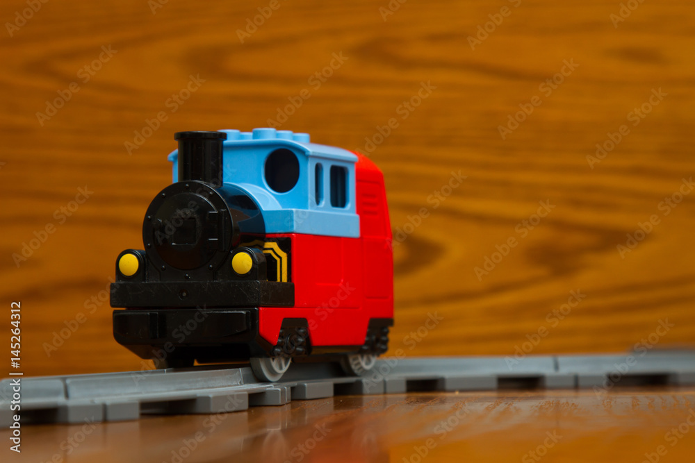 Fototapeta premium toy train rides on rails