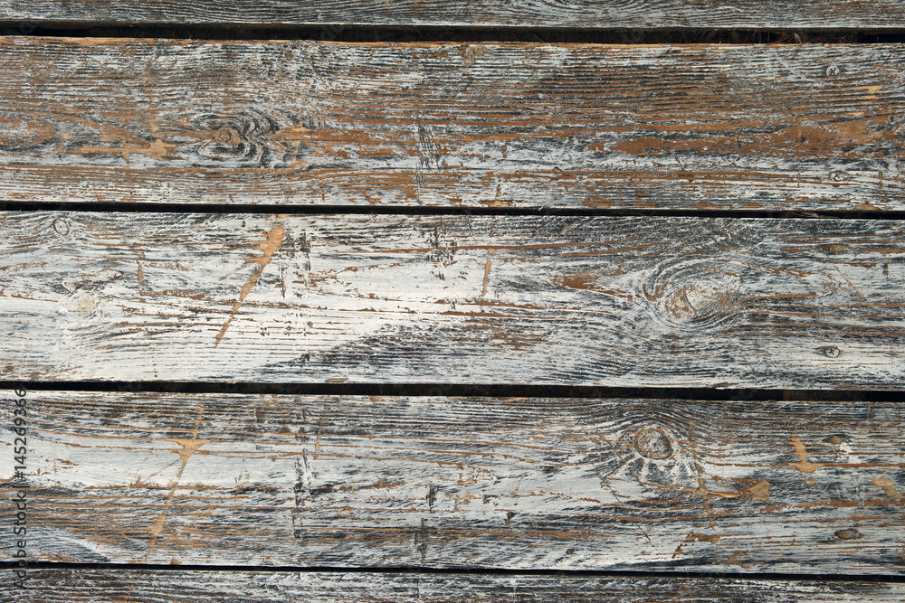 Horizontal old cracked wooden plates with horizontal gaps, planks and chinks Horizontal old cracked wooden plates with horizontal gaps, planks and chinks