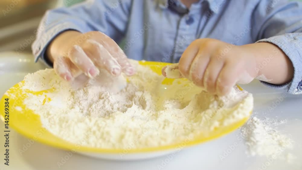 Little Boy Playing With Flour in The Kitchen. 4K Little Boy Playing With Flour in The Kitchen. 4K