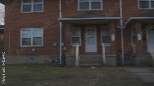 Driving Through Small Urban Town During Sunset