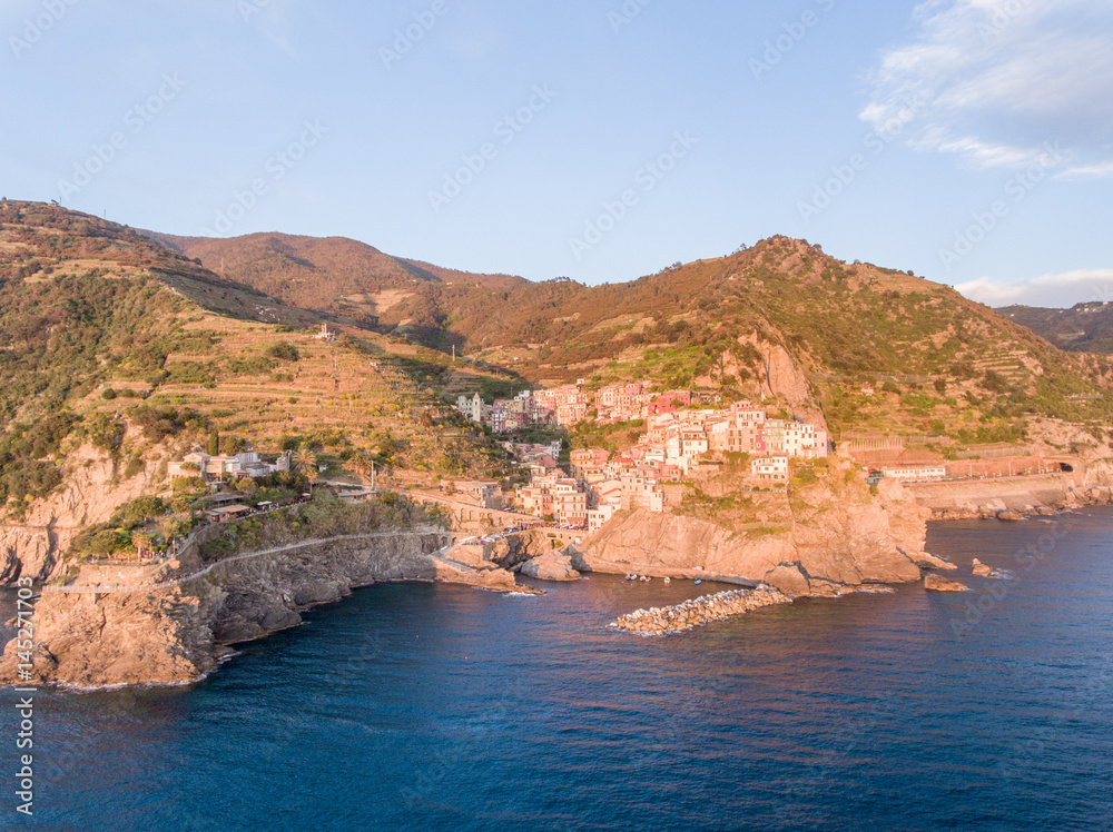 Aerial sunset view of Manarola from helicopter - Five Lands, Italy