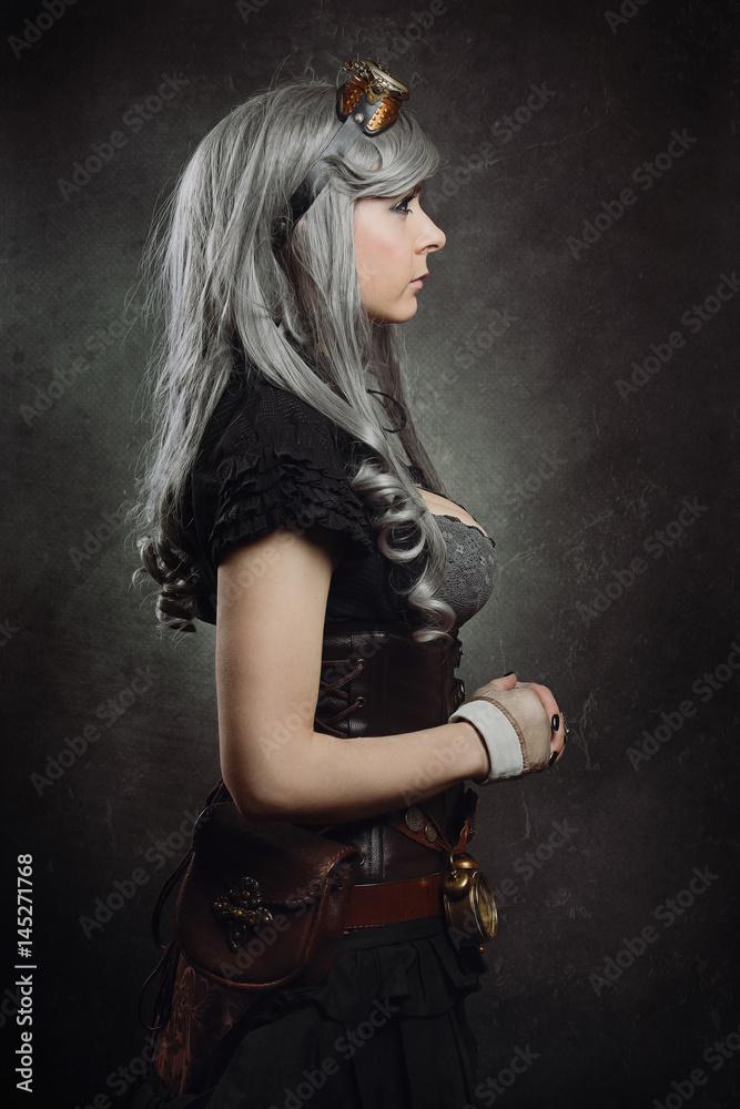 Fototapeta premium Sideaways portrait of a steampunk girl