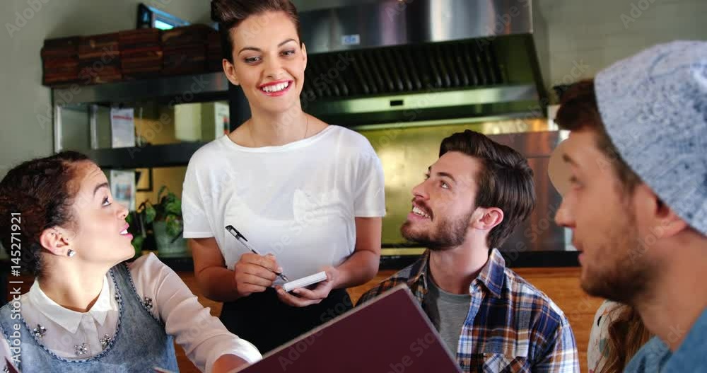 Waitress taking order from customers