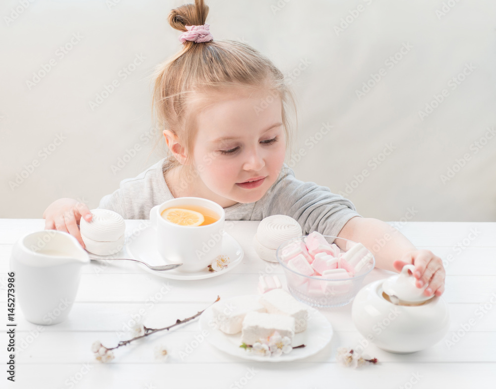 Little girl with sweets around her Little girl with sweets around her