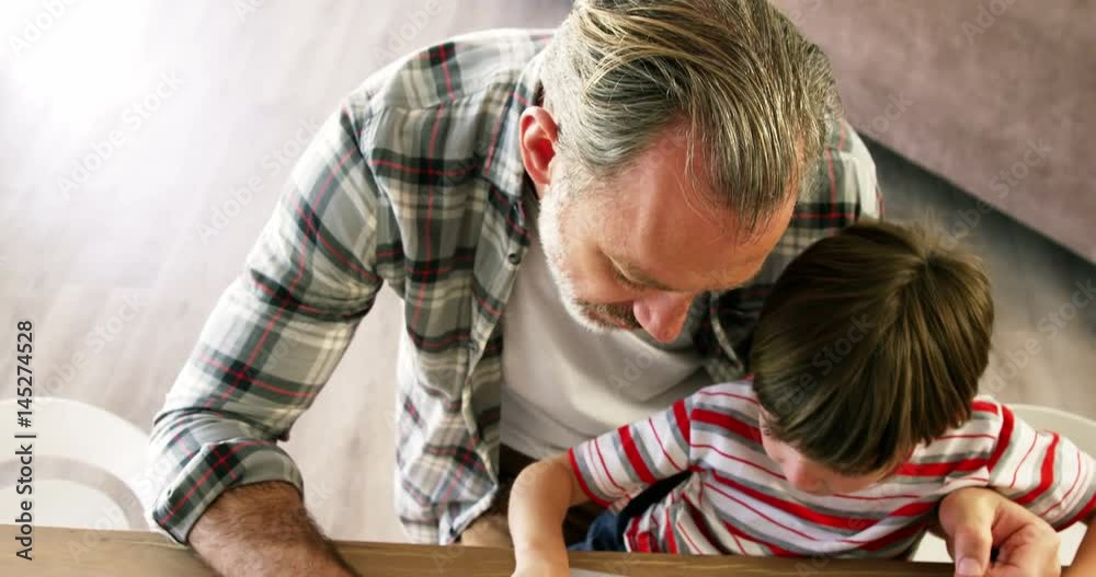 Father and son using laptop Father and son using laptop