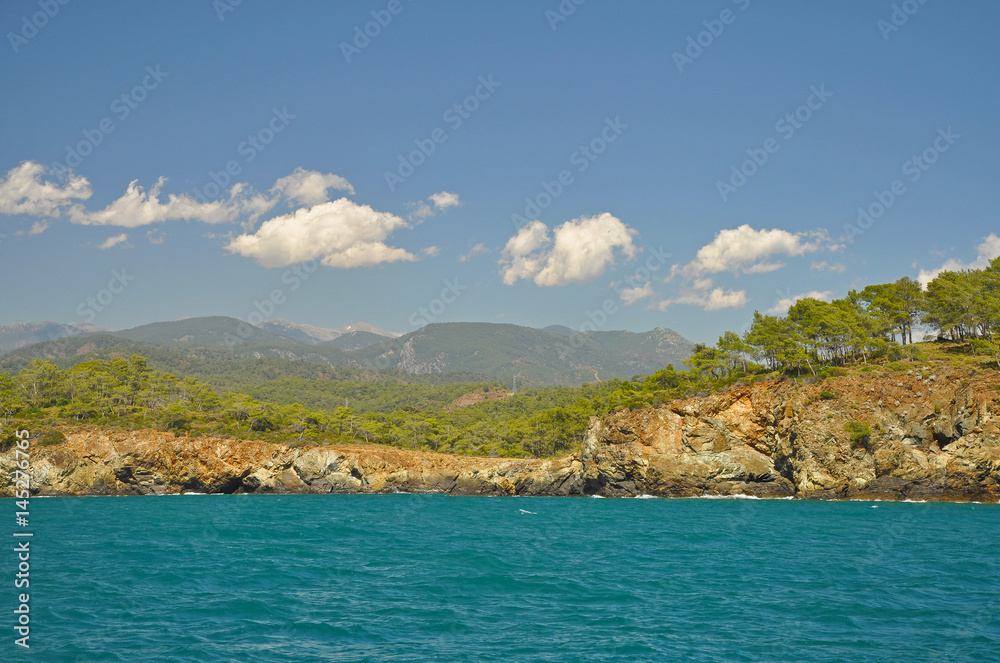 Seascape with azure sea and mountains