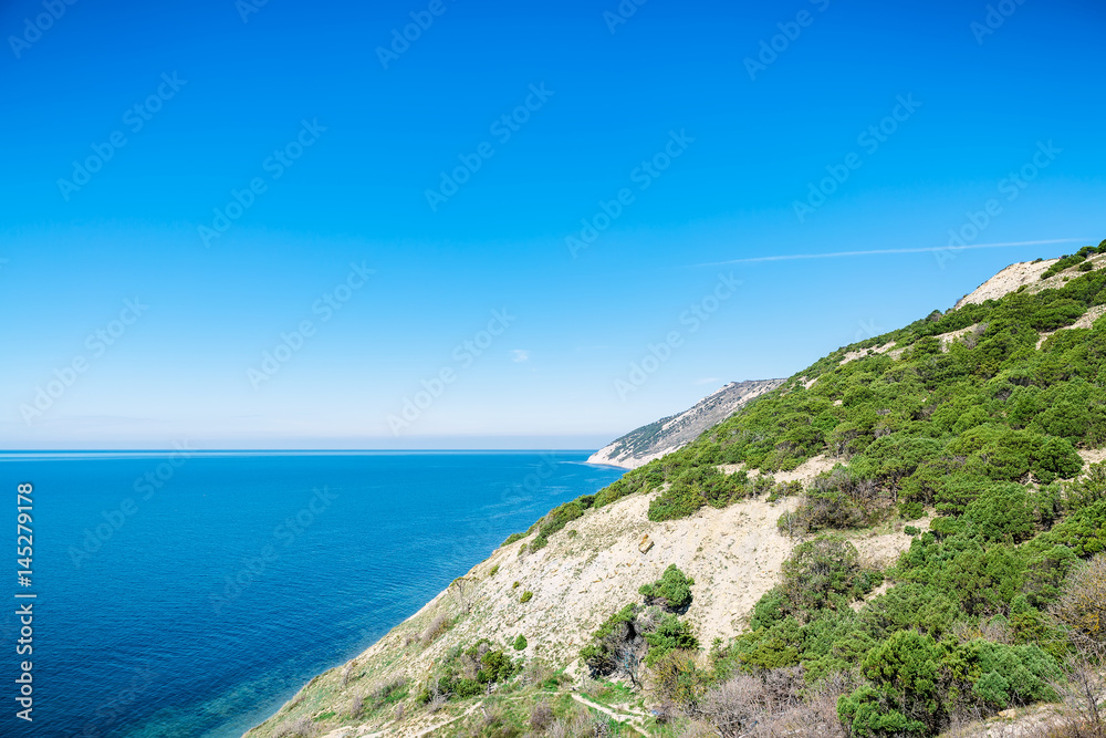 Blue sea and cliff in the Mediterranean. Summer day on sea