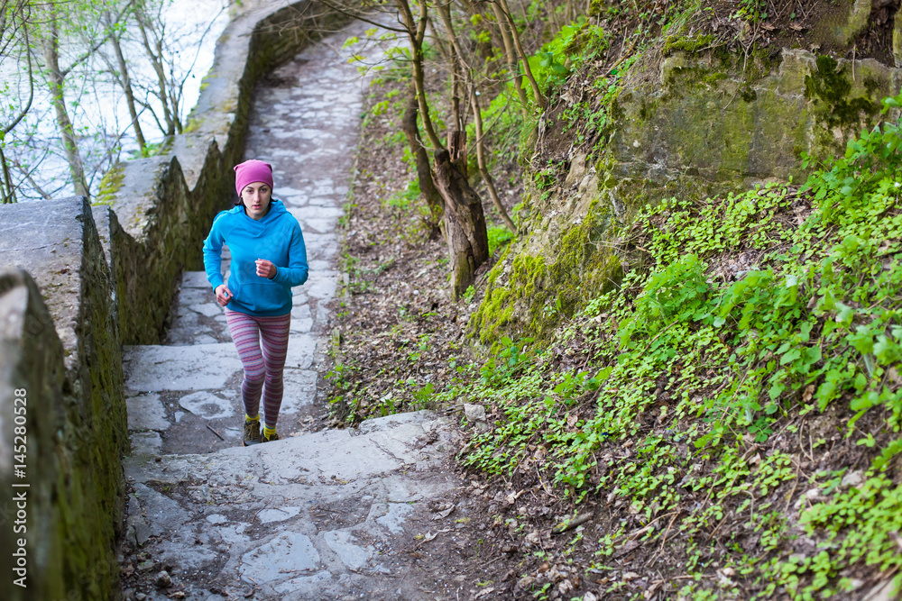 The woman running the stairs in the Park. The woman running the stairs in the Park.