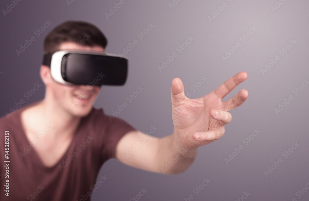 Man wearing virtual reality goggles Man wearing virtual reality goggles